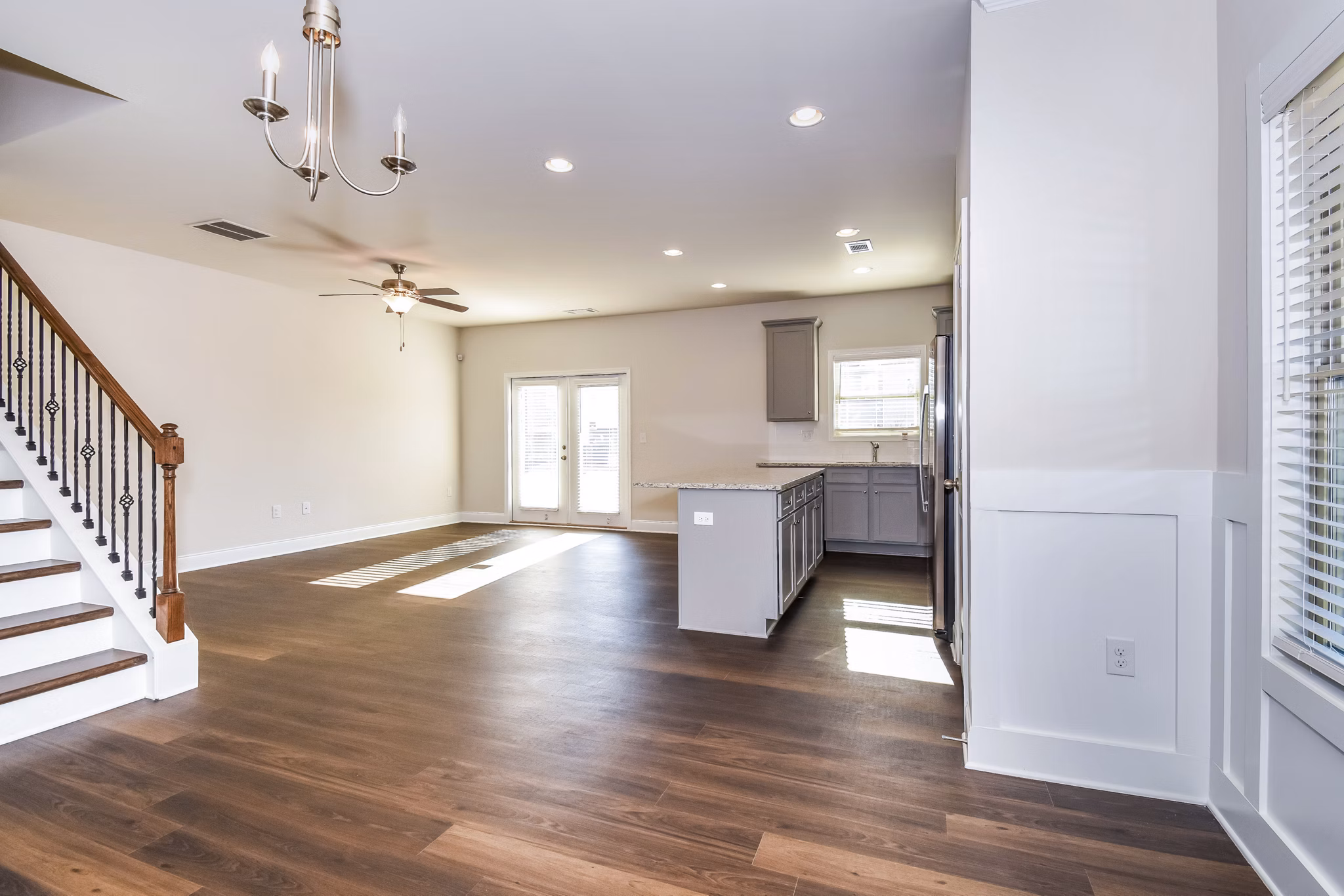 Dining room featuring elegant lighting and modern furnishings at Tranquil Gardens Apartments