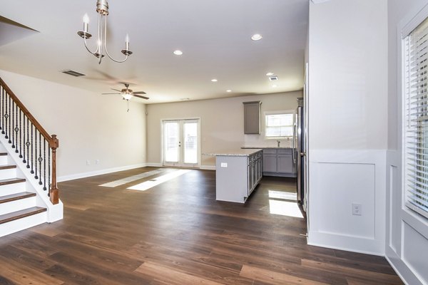 Dining room featuring elegant lighting and modern furnishings at Tranquil Gardens Apartments