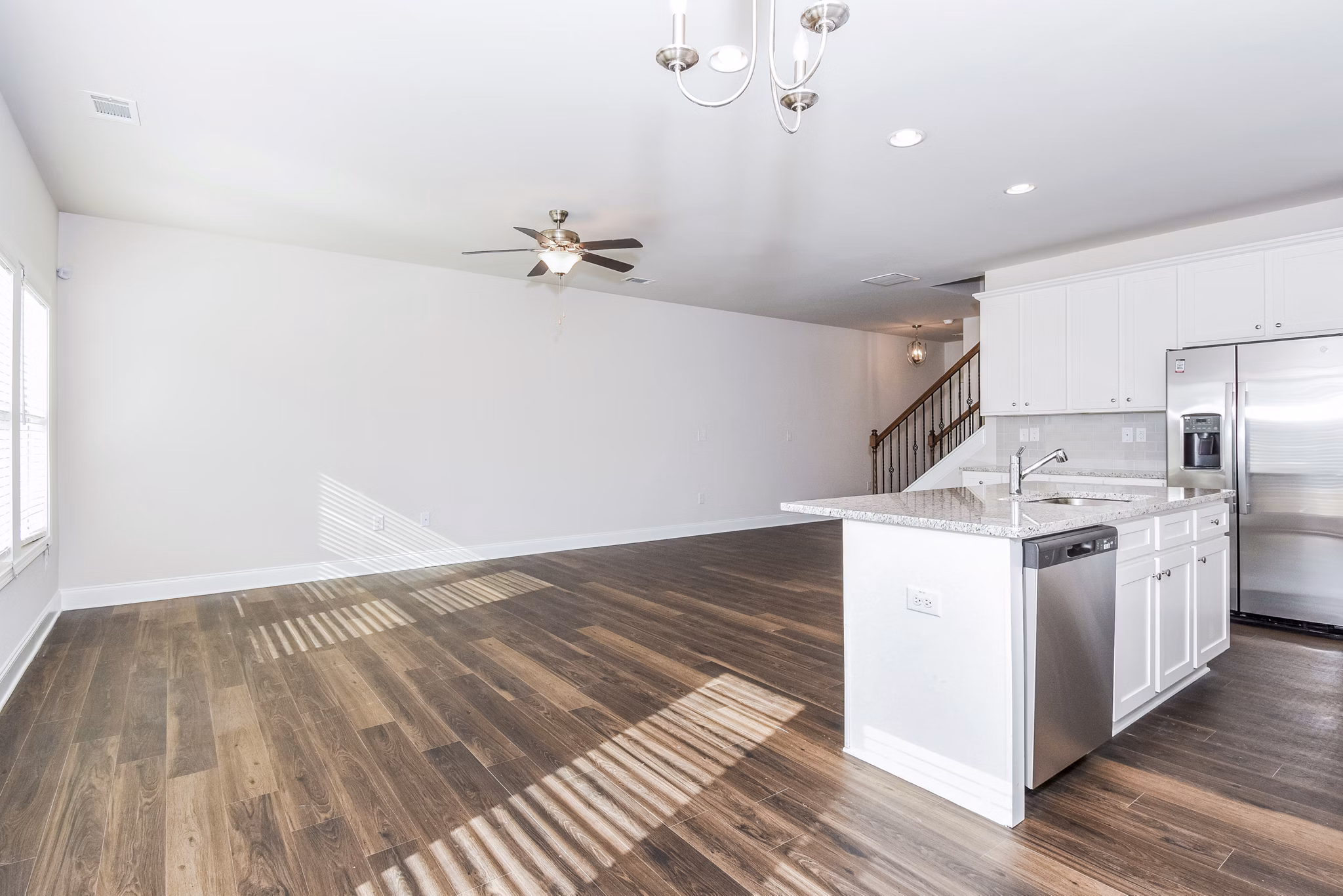 Contemporary kitchen with stainless steel appliances at Tranquil Gardens Homes, a luxury feature enhancing your apartment living experience