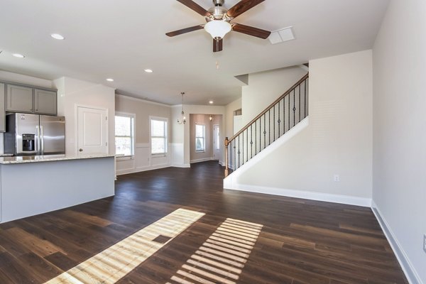 Spacious living room with elegant decor at Tranquil Gardens Homes