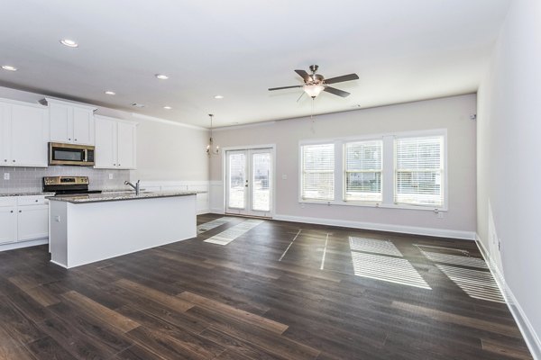 Spacious modern living room with elegant furnishings at Tranquil Gardens Homes luxury apartments
