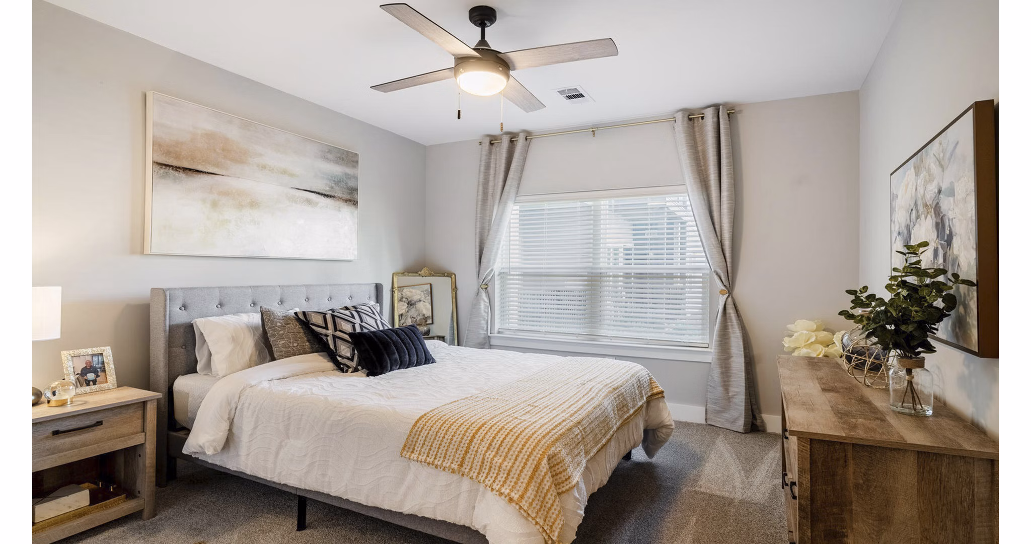 Cozy bedroom with stylish decor at Outlook Gwinnett Apartments