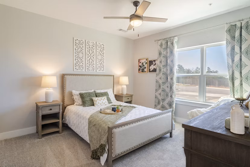 Cozy bedroom with elegant decor in Outlook Gwinnett Apartments