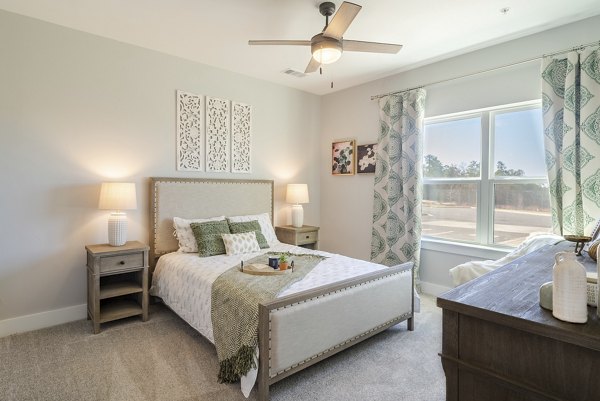 Cozy bedroom with elegant decor in Outlook Gwinnett Apartments