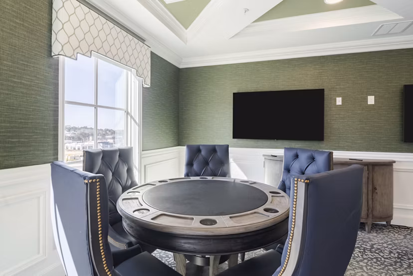 Game room with billiards and seating at Outlook Gwinnett Apartments, offering recreational spaces for residents in a luxury community setting