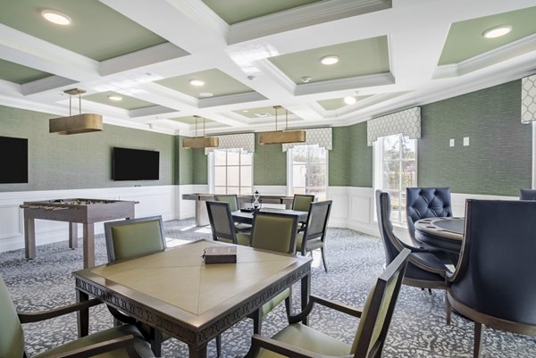 Modern game room with pool table and lounge seating at Outlook Gwinnett Apartments