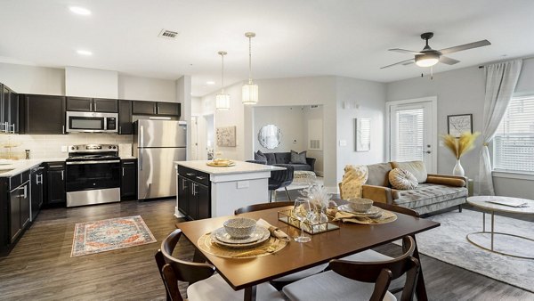 Dining area featuring modern furnishings and ample natural light in Outlook Gwinnett Apartments