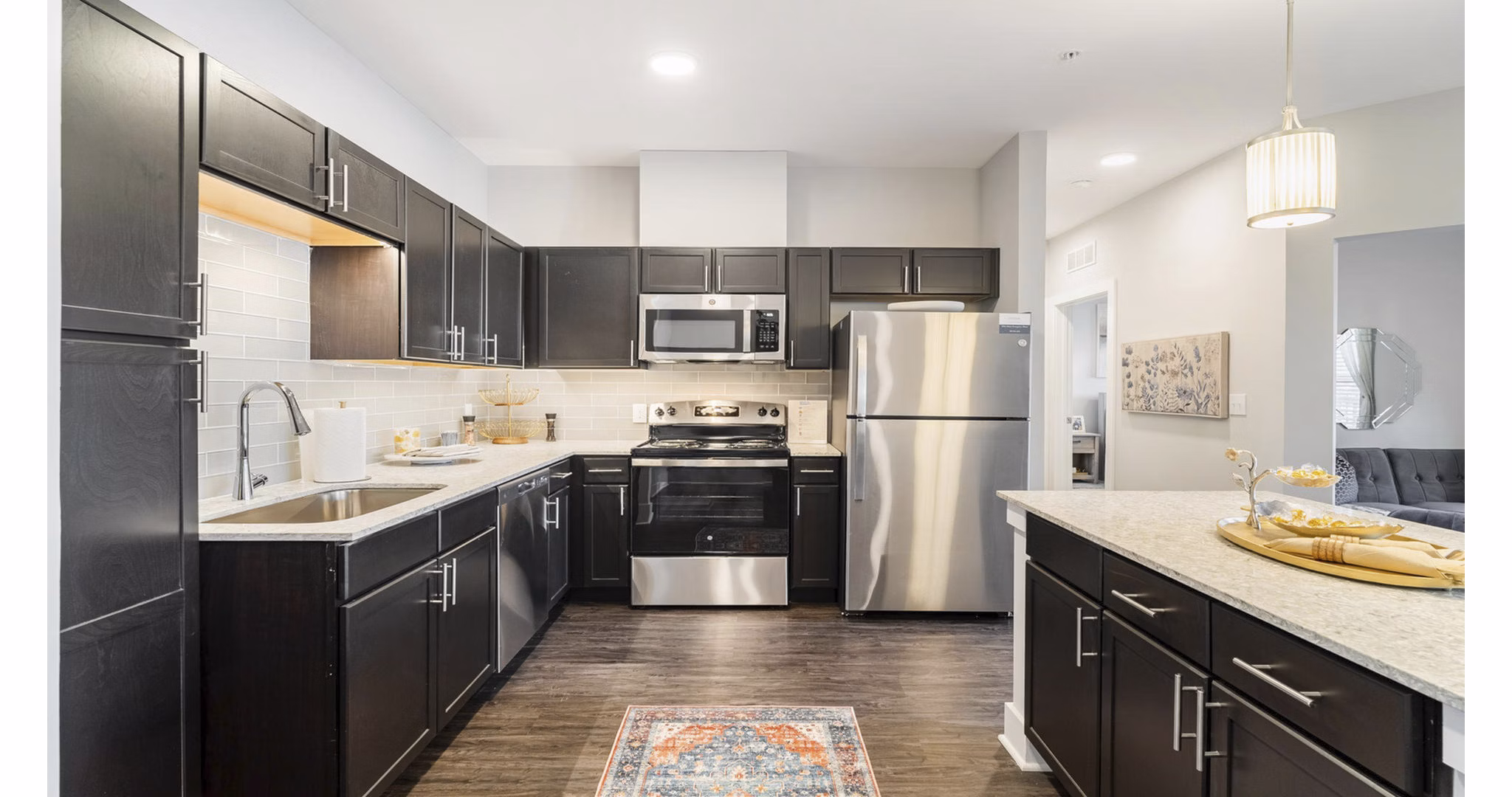 Modern kitchen with stainless steel appliances at Outlook Gwinnett Apartments, offering luxury living spaces for residents