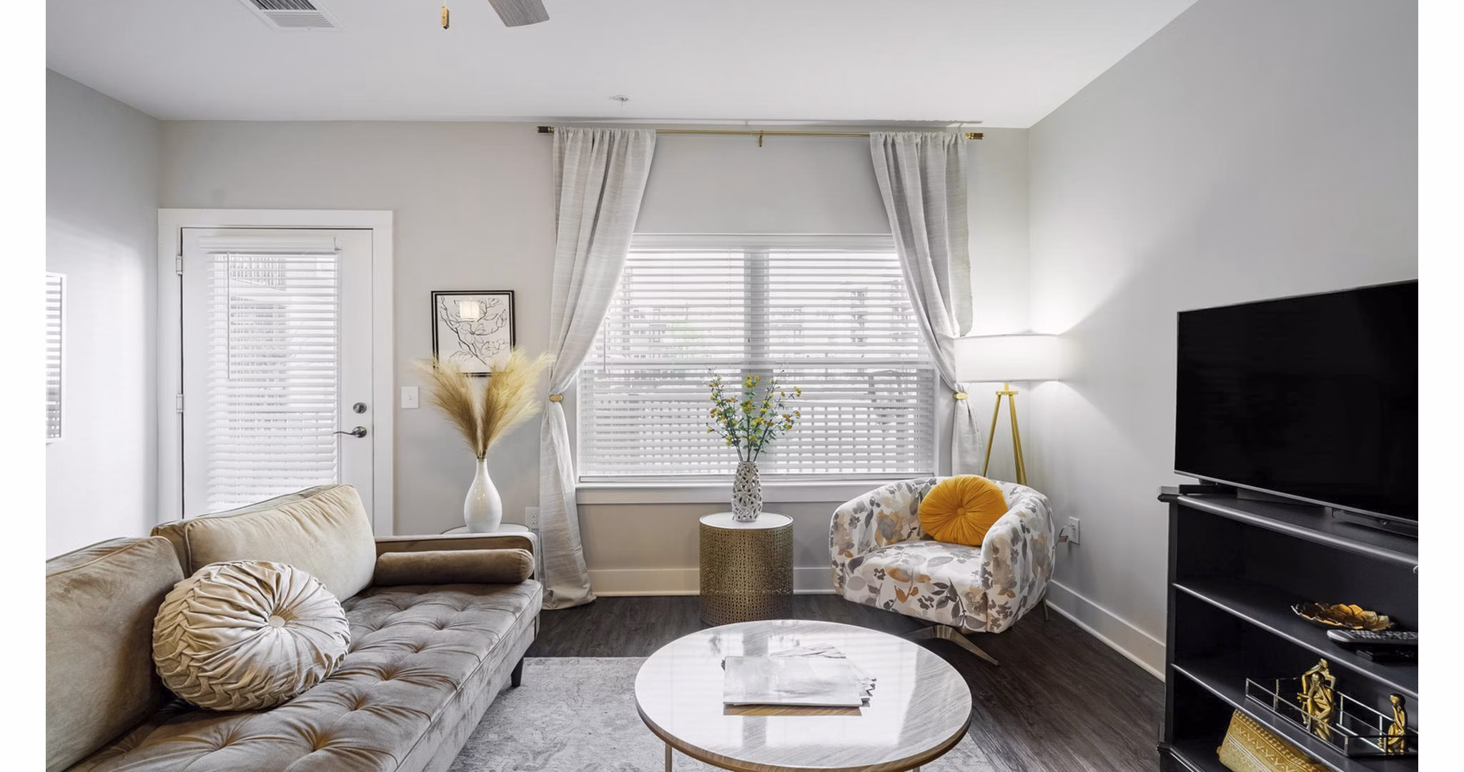 Spacious living room with modern decor in Outlook Gwinnett Apartments