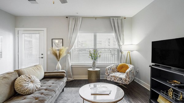 Spacious living room with modern decor in Outlook Gwinnett Apartments