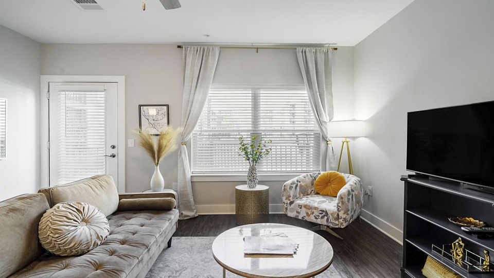 Spacious living room with modern decor in Outlook Gwinnett Apartments