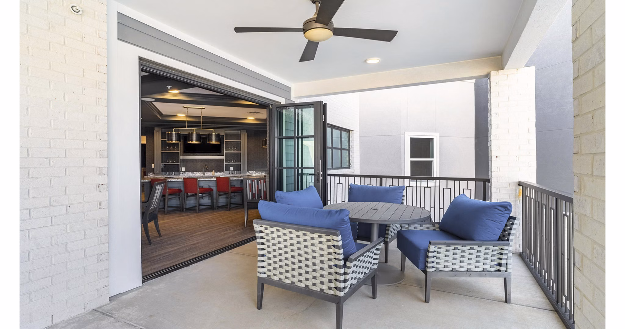 Cozy outdoor patio with comfortable seating at Outlook Gwinnett Apartments