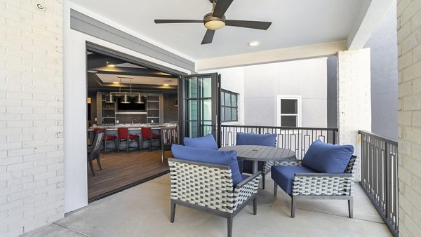 Cozy outdoor patio with comfortable seating at Outlook Gwinnett Apartments