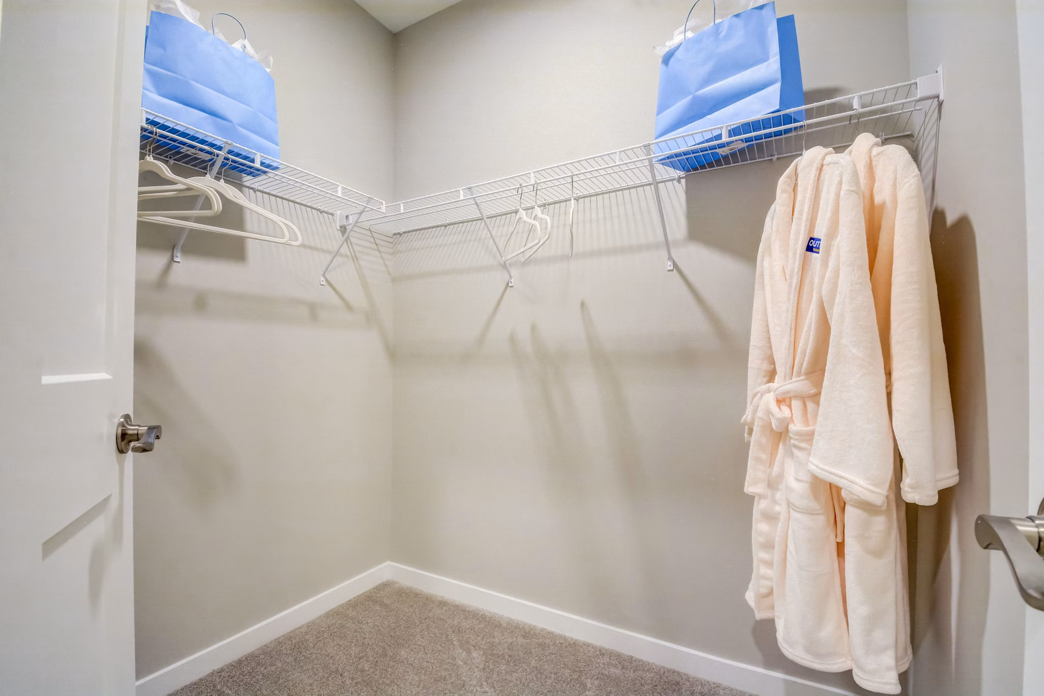 Walk-in closet with ample storage space at Outlook Hamilton Apartments
