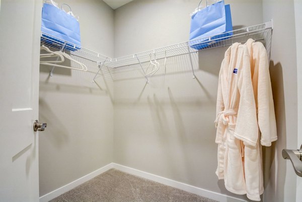 Walk-in closet with ample storage space at Outlook Hamilton Apartments
