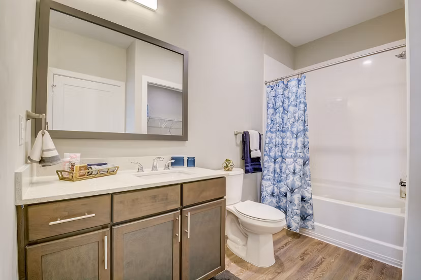 Modern bathroom featuring sleek fixtures and marble countertops in Outlook Hamilton Apartments