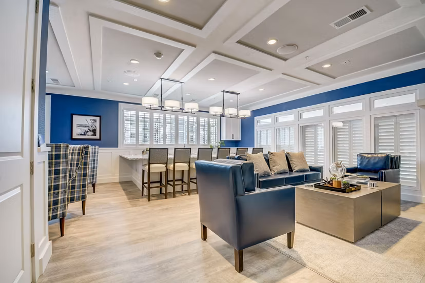 Modern clubhouse featuring expansive seating and large-screen TV at Outlook Hamilton Apartments