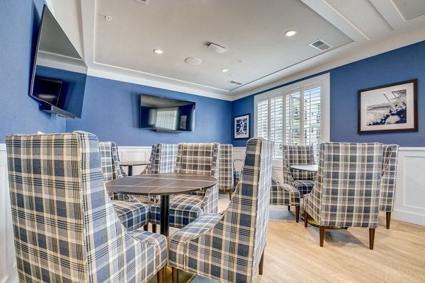 Clubhouse with modern design and cozy seating at Outlook Hamilton Apartments