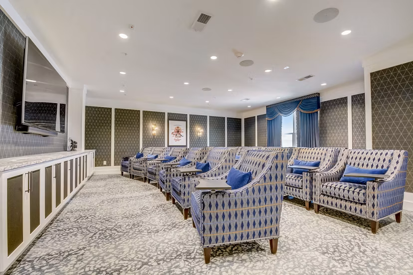 Theater with plush seating at Outlook Hamilton Apartments offering luxury movie experiences in a comfortable setting