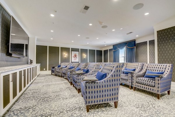 Theater with plush seating at Outlook Hamilton Apartments offering luxury movie experiences in a comfortable setting