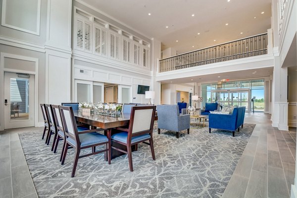 Modern clubhouse featuring spacious lounge and entertainment area at Outlook Hamilton Apartments