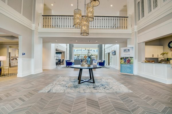 Elegant clubhouse with modern decor at Outlook Hamilton Apartments, perfect for social gatherings and events in a luxurious community setting