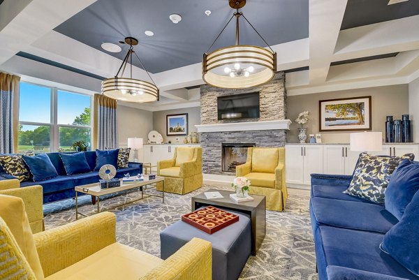 Clubhouse with modern decor and seating areas at Outlook Hamilton Apartments, a luxury Greystar property in a vibrant community