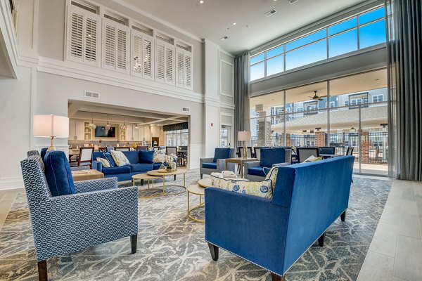 Elegant clubhouse featuring modern design and cozy seating at Outlook Hamilton Apartments