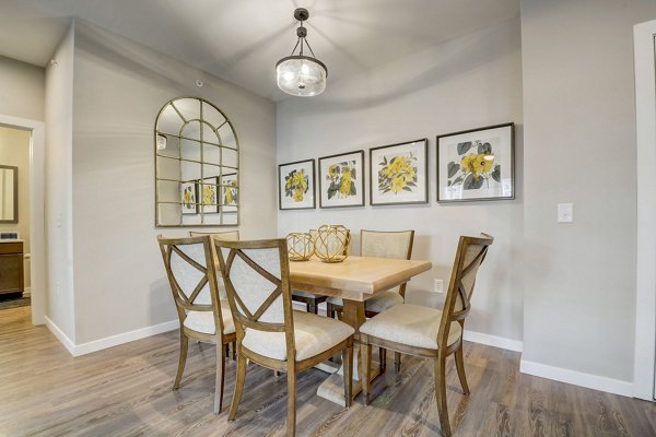 Dining area featuring sleek furniture and modern design at Outlook Hamilton Apartments, a luxurious Greystar community