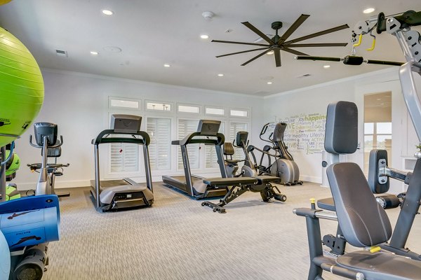 State-of-the-art fitness center with modern equipment at Outlook Hamilton Apartments