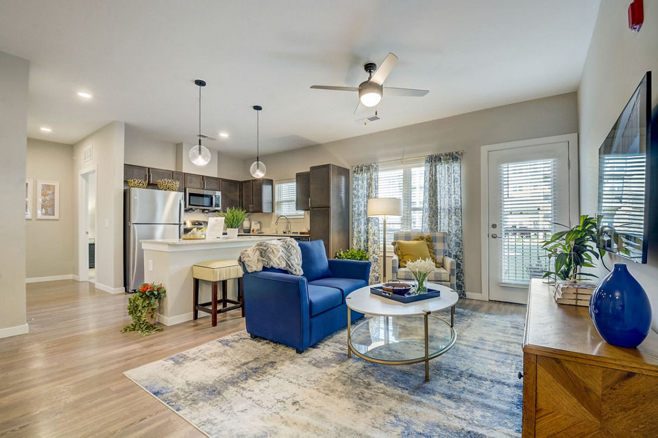 Modern living room with sleek furnishings and natural light at Outlook Hamilton Apartments