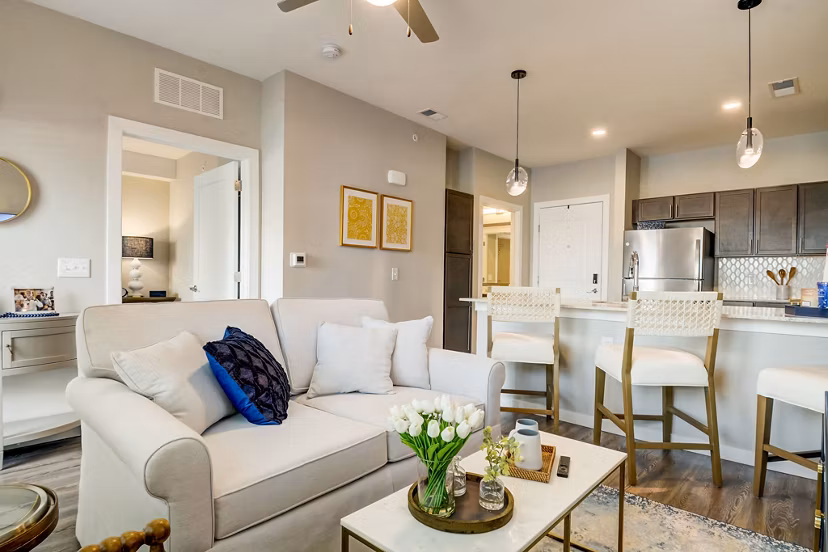 Spacious living room with modern decor at Outlook Hamilton Apartments featuring luxury amenities