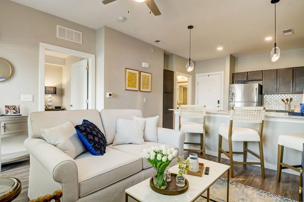 Spacious living room with modern decor at Outlook Hamilton Apartments featuring luxury amenities
