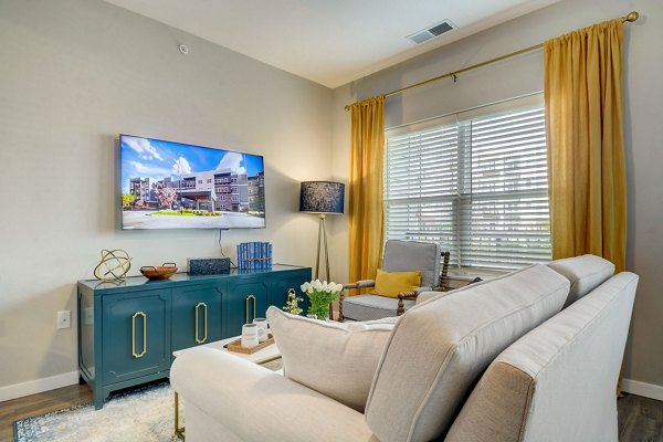 Spacious living room with modern decor at Outlook Hamilton Apartments