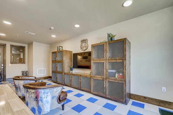 Clubhouse featuring modern design and lush seating area at Alders Magnolia Apartments
