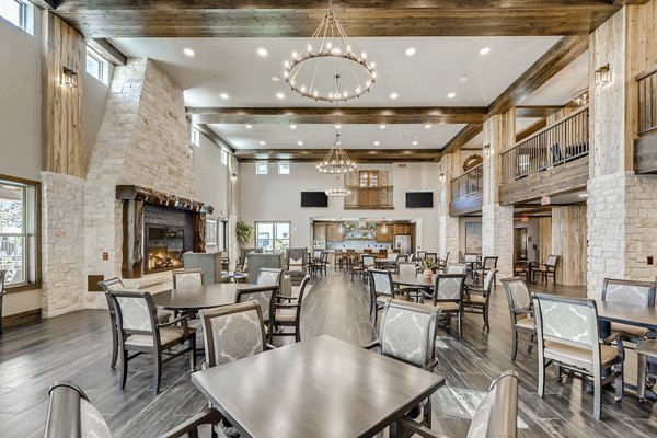 Clubhouse featuring modern decor and seating areas at Alders Magnolia Apartments