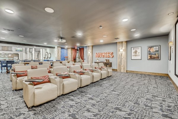 Theater featuring plush seating and state-of-the-art sound system at Alders Magnolia Apartments