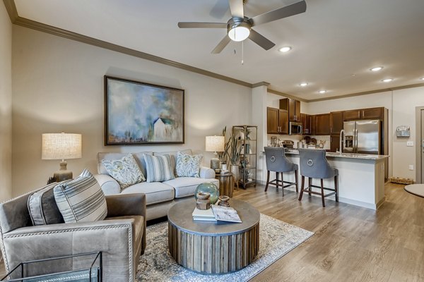 Spacious living room with modern decor at Alders Magnolia Apartments