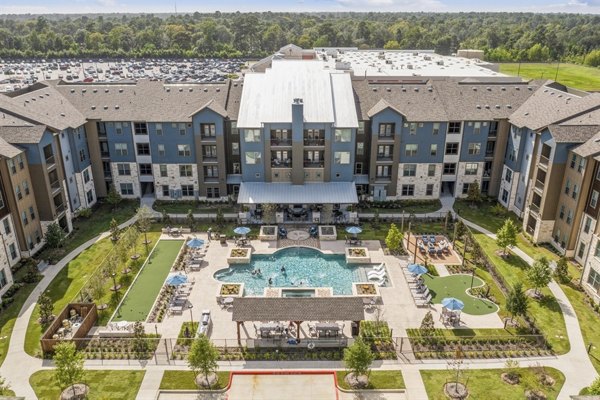Alders Magnolia Apartments: Scenic view from a luxury apartment, showcasing lush greenery and city skyline in the background