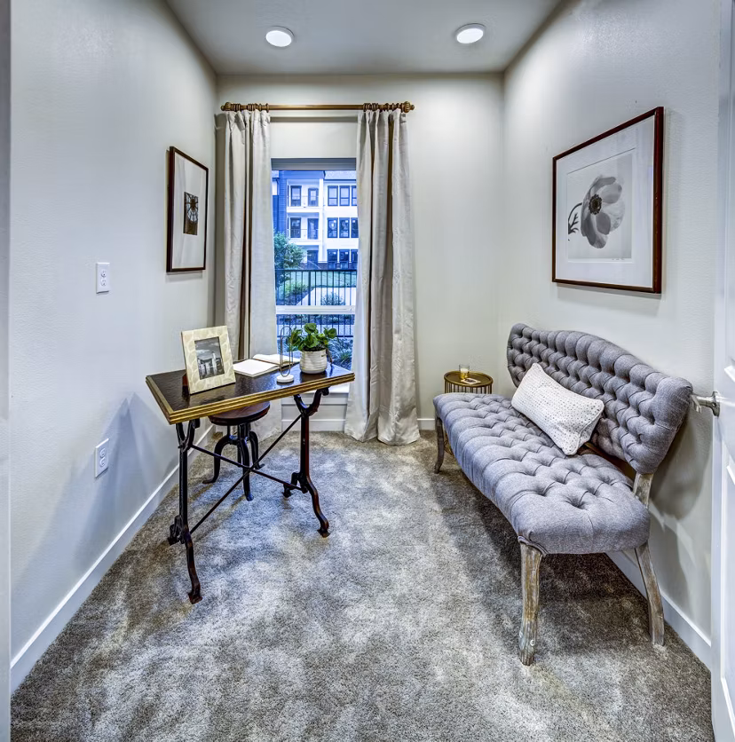 Home office with ergonomic chair and large desk at NorthStar Georgetown Apartments