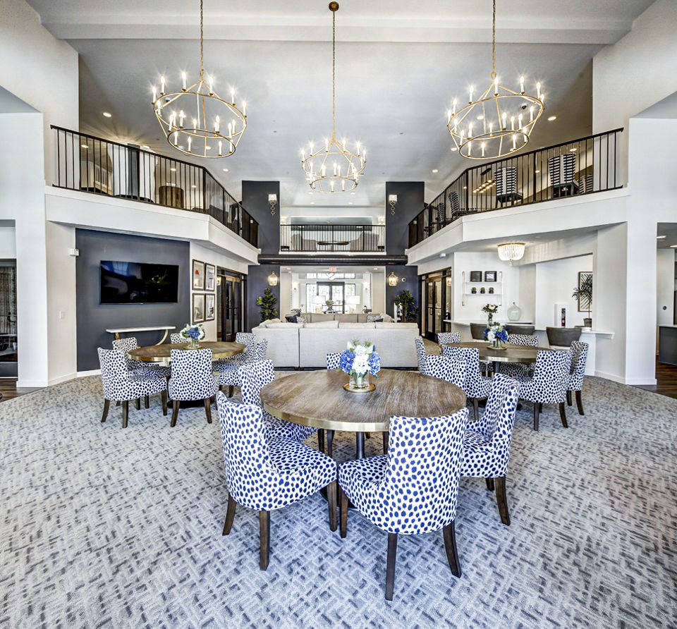 Clubhouse featuring modern lounge with seating areas at NorthStar Georgetown Apartments