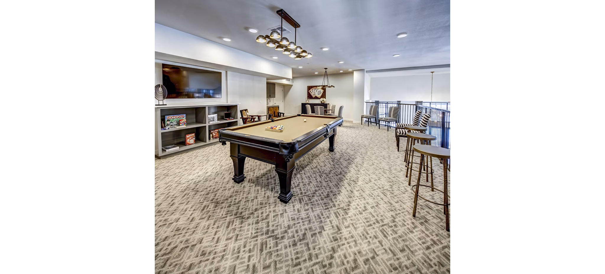 Clubhouse game room featuring pool table and modern seating at NorthStar Georgetown Apartments