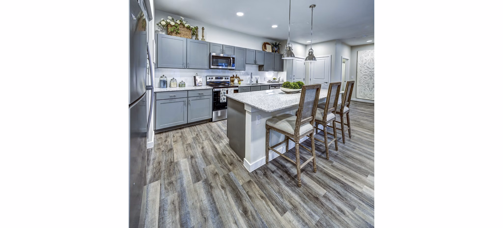 Modern kitchen with stainless steel appliances and quartz countertops at NorthStar Georgetown Apartments