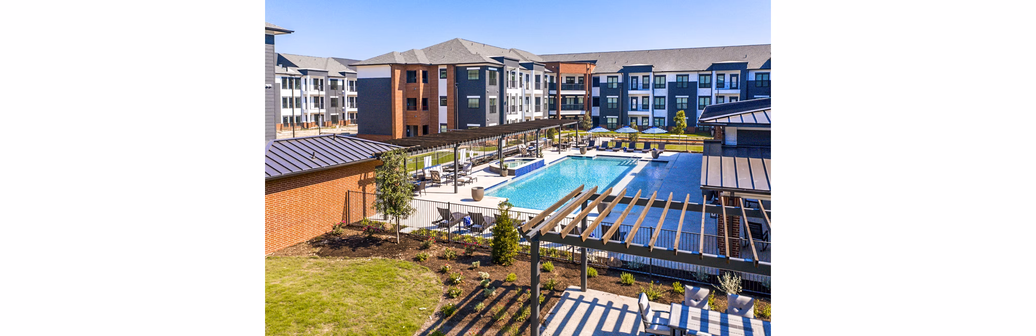 Resort-style pool with lounge chairs at NorthStar Georgetown Apartments