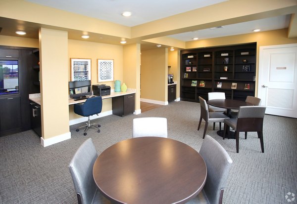 Business center featuring modern workstations at The Orchards at Arlington Highlands Apartments