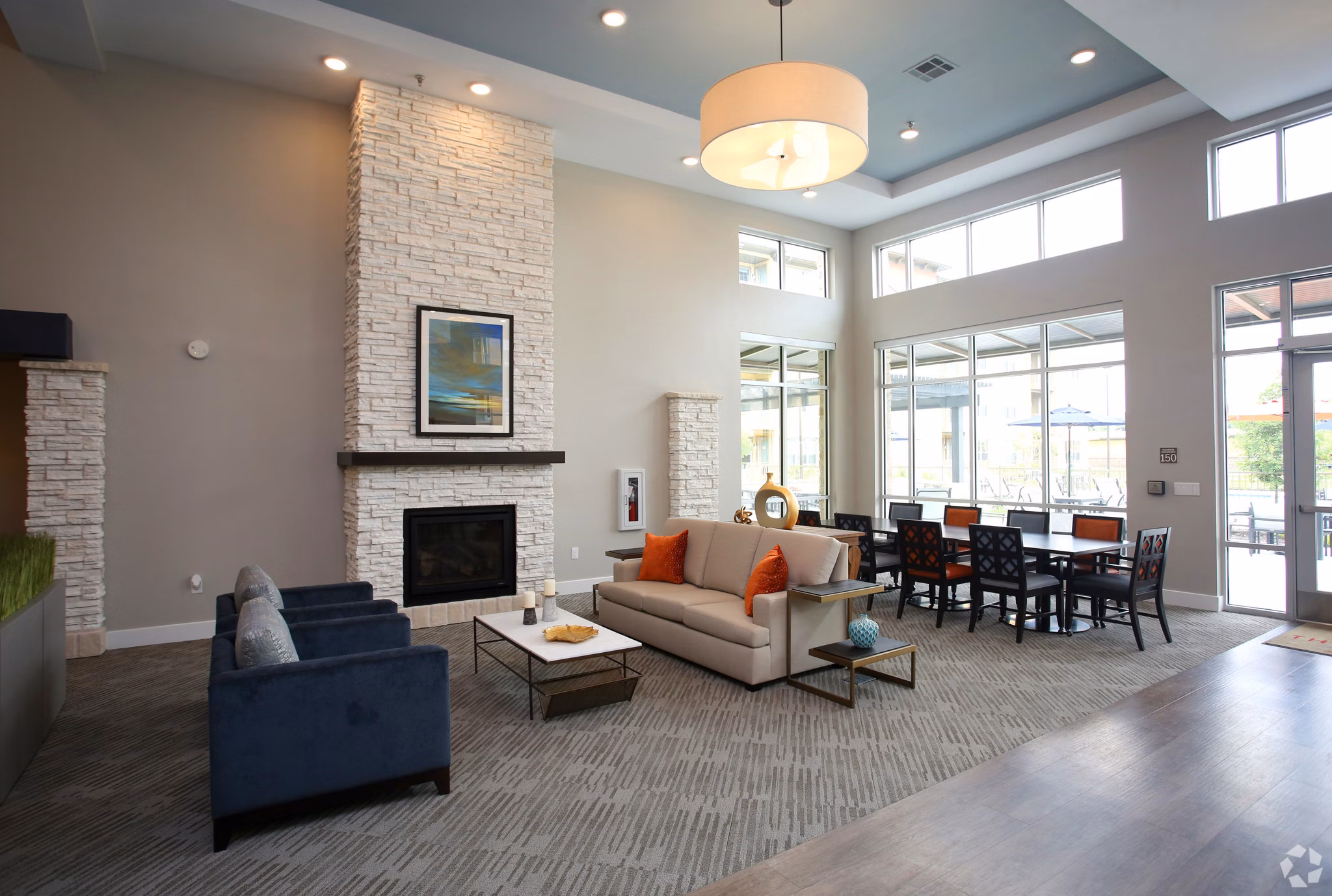 The Orchards at Arlington Highlands Apartments: Stylish clubhouse with modern seating and decor in upscale luxury community