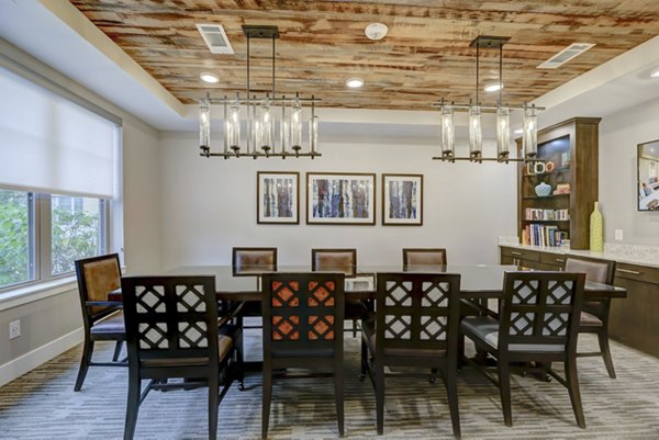 Modern meeting facility with sleek conference table at The Orchards at Arlington Highlands Apartments