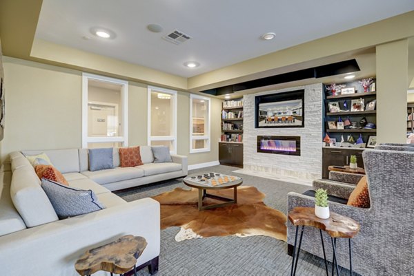 Chic clubhouse featuring modern dÃ©cor and seating at The Orchards at Arlington Highlands Apartments