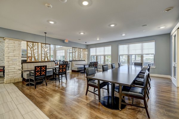 Clubhouse with modern decor and entertainment facilities at The Orchards at Arlington Highlands Apartments