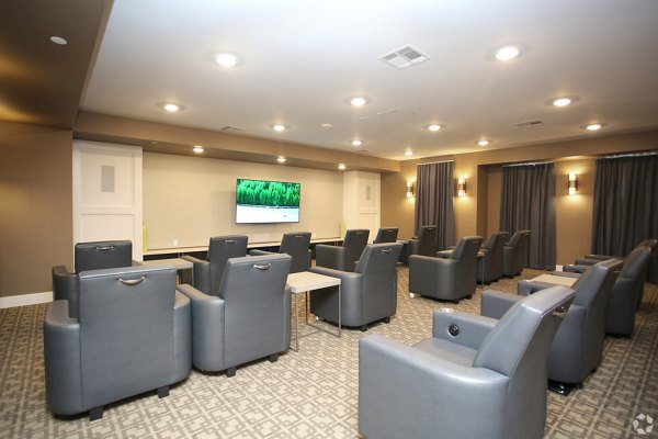 Luxury theater room with plush seating at The Orchards at Arlington Highlands apartments